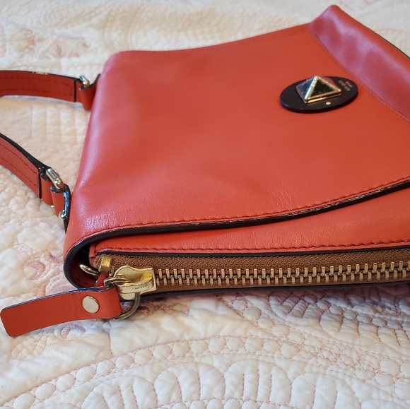 Kate Spade orange leather purse.  12" x 9" Two side zippers three inside pockets - Picture 2 of 11